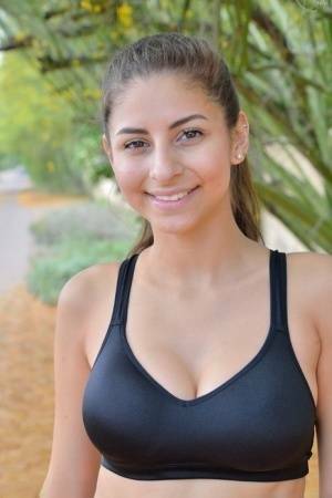 Teen jogger pauses to take off her spandex pants and bra on a run on adultfans.net