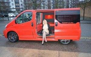 Mature blonde Barby Slut exposes herself inside a camper while in the city on adultfans.net