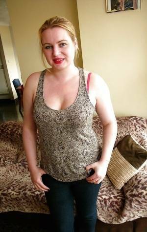 Amateur Euro plumper Amber West exposing big tits and hairy vagina on adultfans.net