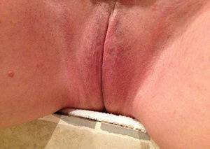 Older amateur Busty Bliss finger spreads her pink vagina after showering on adultfans.net