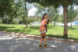 Latina solo girl Carolina Abril shedding shorts to expose nice ass outdoors on adultfans.net