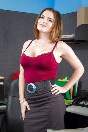 Secretary Krissy Lynn shows her fuckable booty in the office on adultfans.net