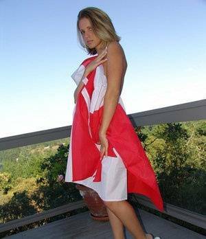 Canadian teen Karen wraps her naked body in a flag on her back deck on adultfans.net