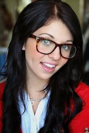 Glasses on round face of cute girl Madelyn Monroe stress her tiny tits on adultfans.net