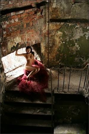 Slim brunette with a great ass models totally naked in deserted building on adultfans.net