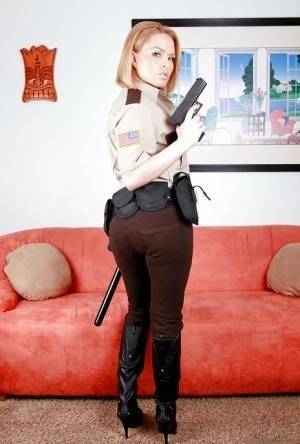 Hot babe in police uniform Krissy Lynn stripping and spreading her legs on adultfans.net