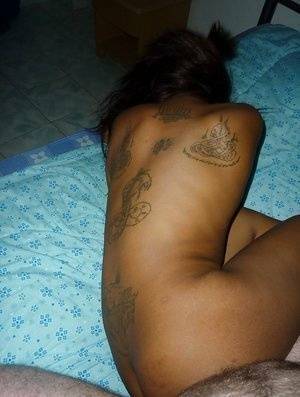 Tattooed Thai girl Nit getting banged bareback on bed by sex tourist - Thailand on adultfans.net