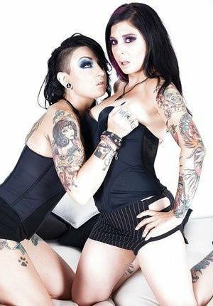 Goth models play with their tatted tight bodies and pussies on adultfans.net