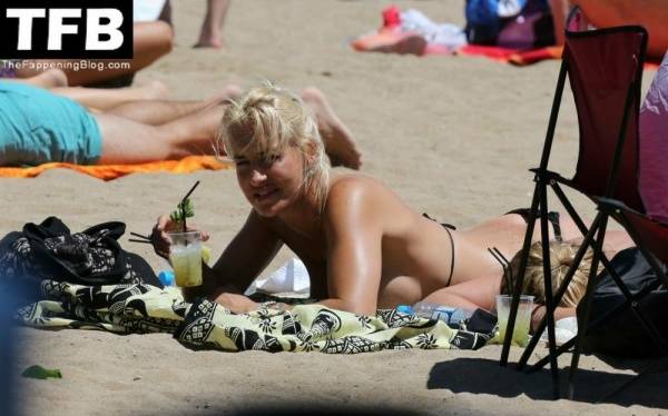 Sarah Connor Flashes Her Nude Breasts on the Beach on adultfans.net