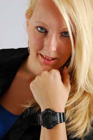 Blue-eyed blonde Britt displays her black G-Shock during non-nude action on adultfans.net