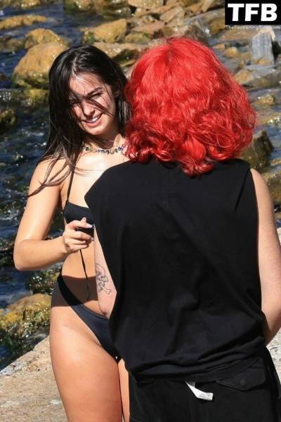 Addison Rae Displays Her Curves in a Black Bikini on Holiday with Omer Fedi on Lake Como on adultfans.net