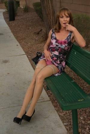 Aged lady flashes her tits and twat on a public bench before disrobing at home on adultfans.net