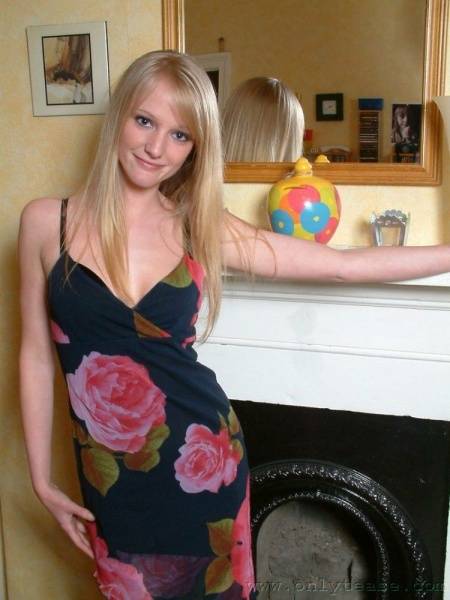 Nice Blonde Chickie Sharon Posing In Dress And Lingerie By The Fireplace photos (Sharon Onlytease) on adultfans.net