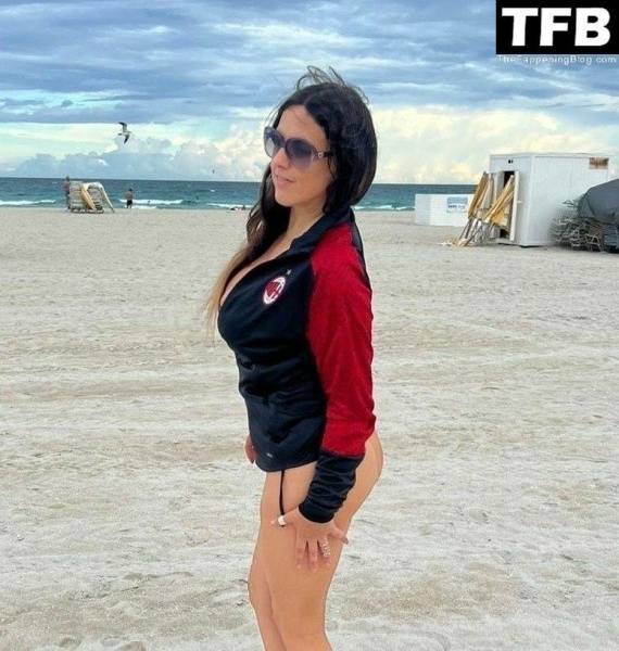 Claudia Romani Supports AC Milan While Tanning on Miami Beach on adultfans.net