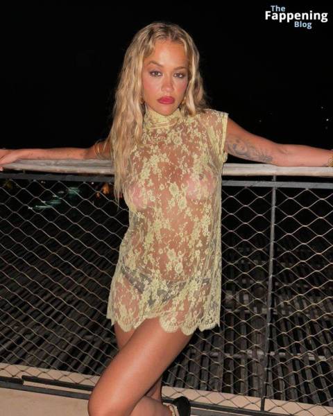 Rita Ora Shows Off Her Nude Boobs While Posing in a Sheer Dress (2 Photos) on adultfans.net