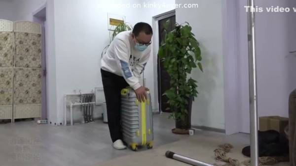 Woman masterfully bound in intricate rope and gagged during intense BDSM session on adultfans.net