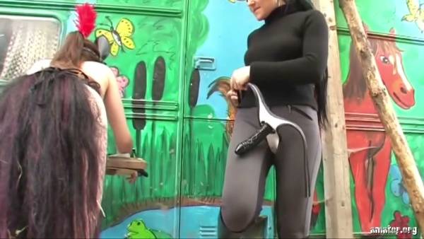 Lesbian strapon play in the woods and rustic dungeon with stockings and bondage on adultfans.net