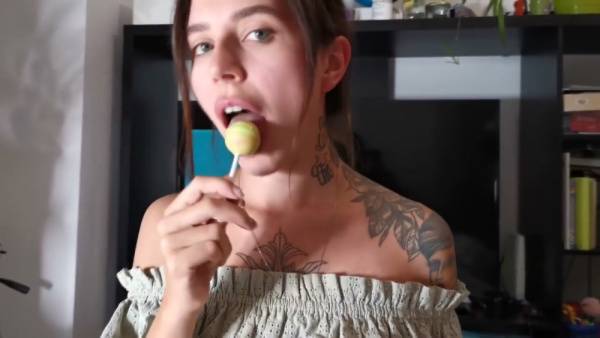 Tattooed brunette gives oral while holding a lollipop in POV shot on adultfans.net
