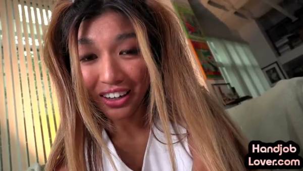 Asian cheerleader in purple skirt gives a passionate POV blowjob in the living room on adultfans.net