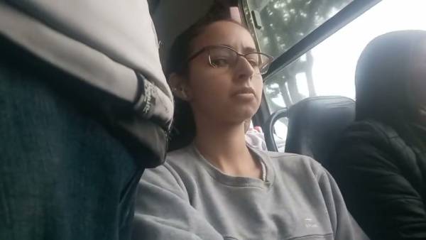 Young Brazilian woman with glasses rests on a bus while being subtly observed - Brazil - Portugal on adultfans.net