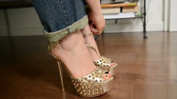 Blonde in gold studded heels and dark lipstick gives a deep blowjob on adultfans.net