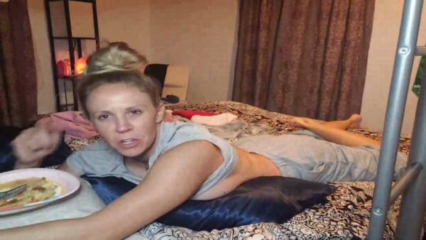 Blonde teases in bed with a playful wink just for you on adultfans.net