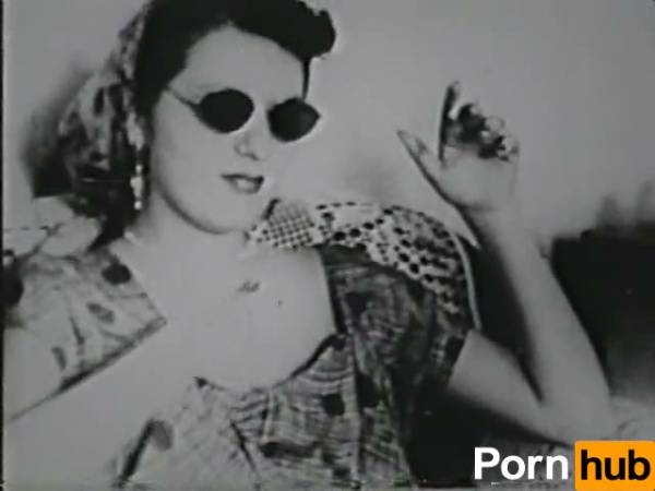 Voluptuous woman in vintage striptease seduces in black and white on adultfans.net