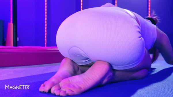 Fitness babe blends yoga poses with intimate self-touch on a purple mat on adultfans.net