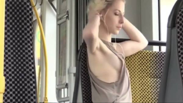 Blonde woman caught on hidden camera riding the bus with arms raised on adultfans.net