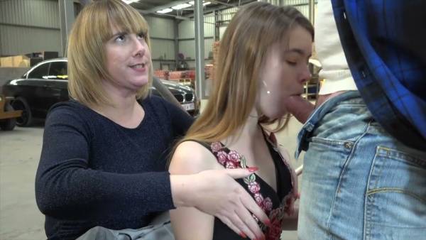 Strict femdom session unfolds in a public warehouse with bondage and deepthroat on adultfans.net