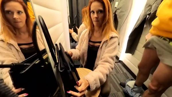 Redhead swallows cum in a mall dressing room then orders coffee with it still in her mouth on adultfans.net