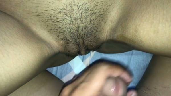 Two dark-skinned men share an intense intimate moment in a red-lit bedroom - Philippines on adultfans.net