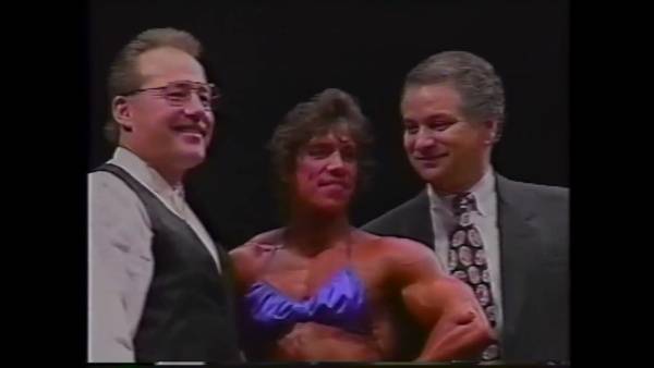 Danielle Leroy strikes a pose on stage at the 1994 NPC USA Nationals - Usa on adultfans.net
