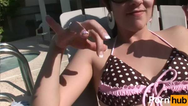 Slim brunette with navel piercing casts off her bikini at sunny poolside party on adultfans.net