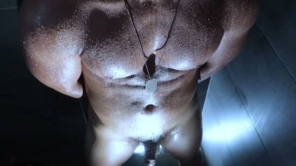Muscular dark-skinned man endures electric play in a steamy solo shower scene on adultfans.net