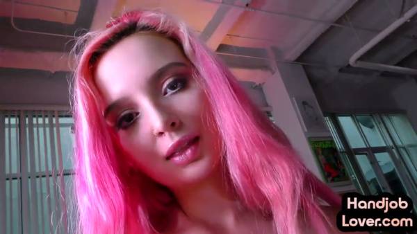 Tattooed pink-haired girlfriend gives handjob in living room on adultfans.net