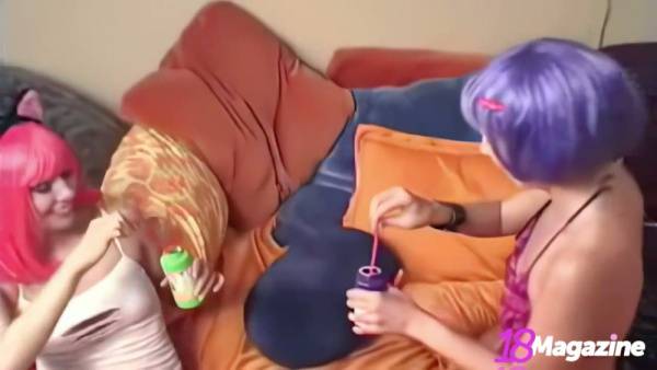 Pink-haired Candie and purple-haired Crush share intimate moments in a playful lesbian encounter on adultfans.net