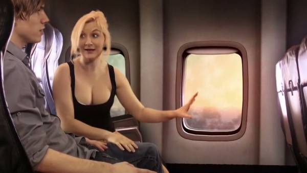 Blonde passenger gives a discreet handjob on a sunset flight on adultfans.net