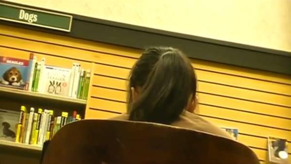 Candid foot fetish moment with a teen girl in the library on adultfans.net