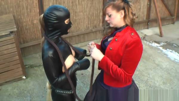 Lady Grace commands her pony in a snowy backyard and dim dungeon on adultfans.net