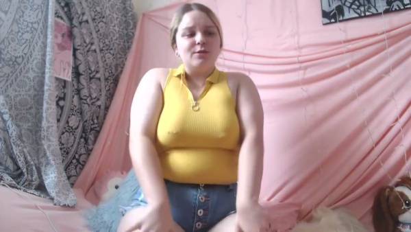 Chubby blonde in yellow tank and cutoff shorts commands worship from her pink bedroom on adultfans.net