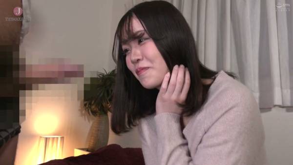 Young Japanese beauty Miho Aikawa gives head on a red couch in a soft-lit room - Japan on adultfans.net