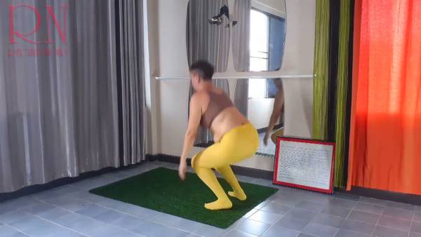 Regina Noir stretches in yellow leggings during a private yoga session at the gym on adultfans.net