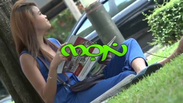 Thai woman with smooth legs straddles a tattooed white man on a beige couch - Thailand on adultfans.net
