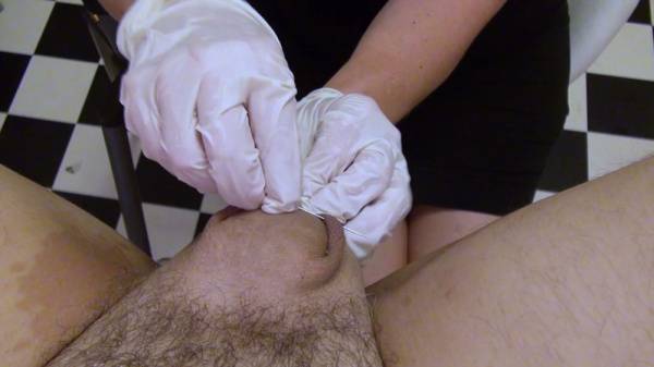Dominant nurse torments a man's cock and balls in a clinical fetish session on adultfans.net