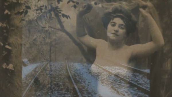 Curated vintage erotica unfolds along a snow-covered railway in moody archival stills on adultfans.net