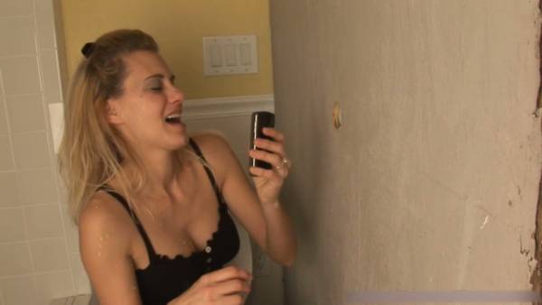 Blonde wife visits a public glory hole and takes a thick cumshot on her face on adultfans.net