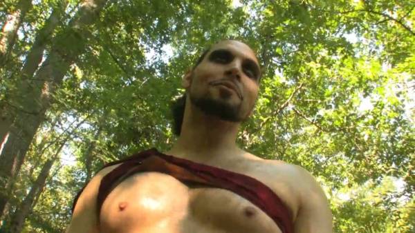 Blonde dominatrix binds and controls her muscular captive in a sunlit forest ritual on adultfans.net