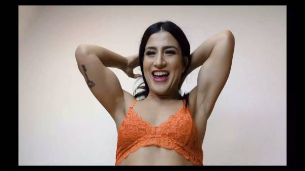 Amateur Latina in orange lace bra flaunts her big ass and tits on the couch on adultfans.net