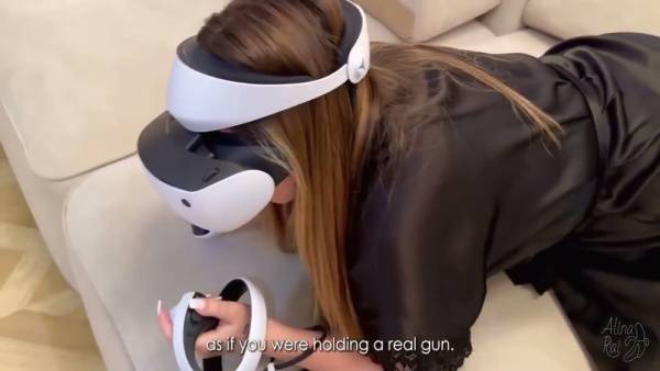 Woman in VR headset gets intimate with another woman in living room on adultfans.net